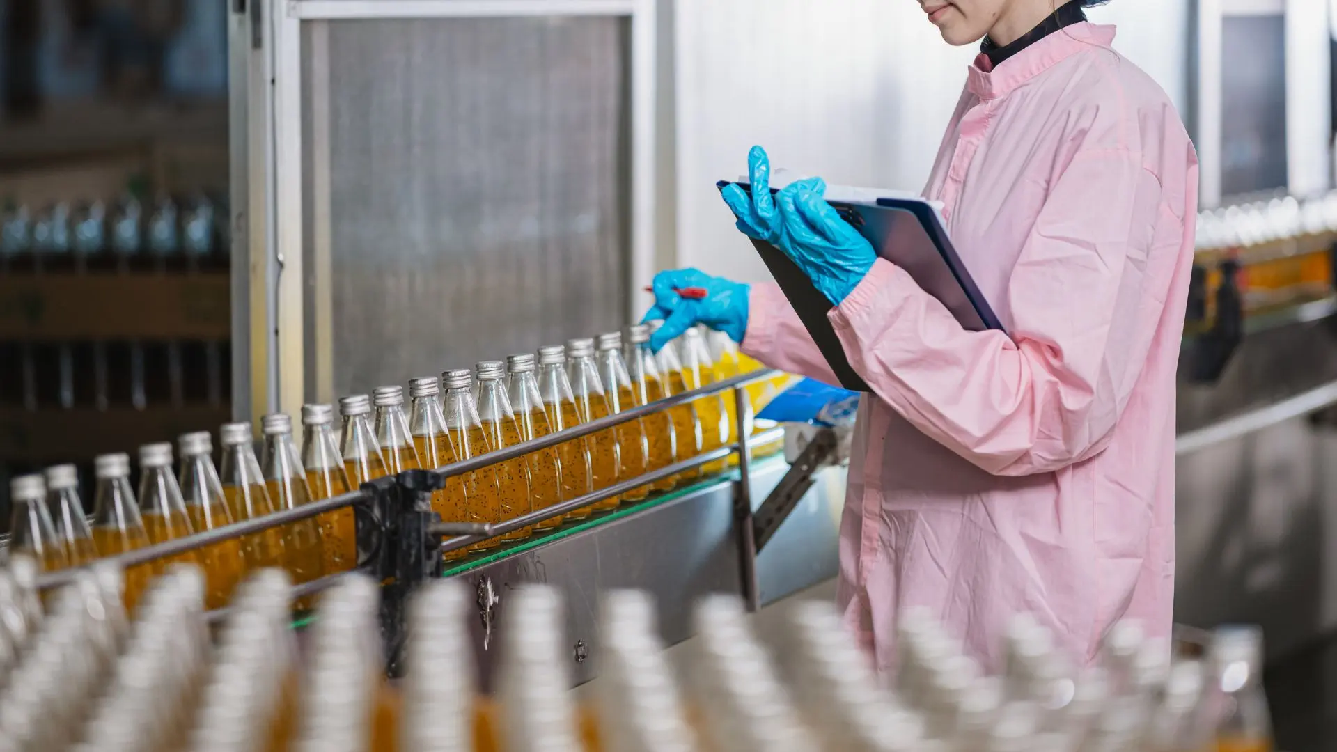 Quality control on a food production line. Certified facilities like this one are where the evidence for smarter, risk-tiered inspection planning is strongest.